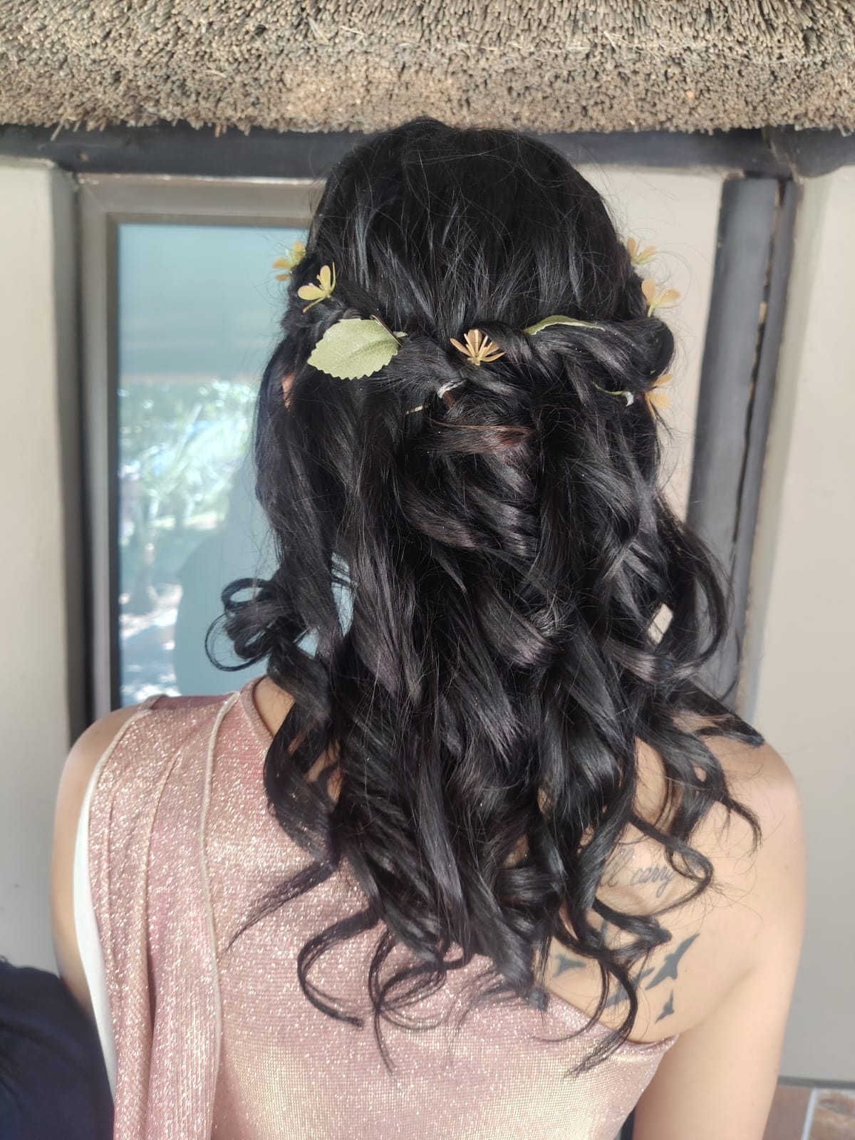 Bridal curls dressed with delicate floral hair accents by Cedar Hair & Makeup